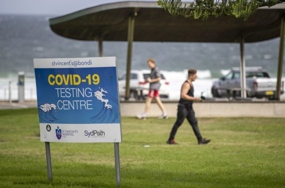 Top Aus health official warns of looming Covid spike